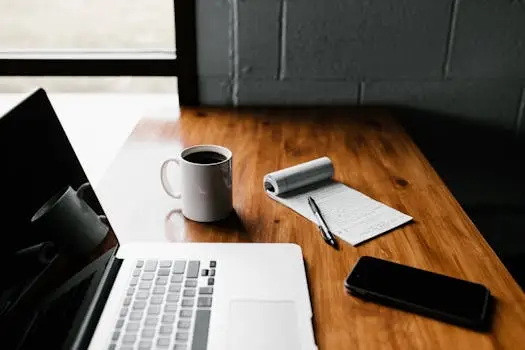 Laptop & coffee cup on a desk Google AdSense Approval Guide 2026 for New Bloggers